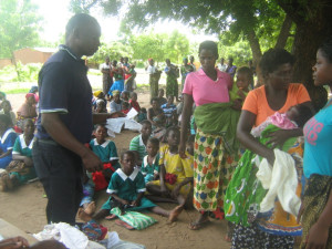 A mother receiving a cloth for her new baby