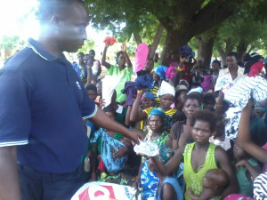 A woman receiving a pair of shoes foir her child